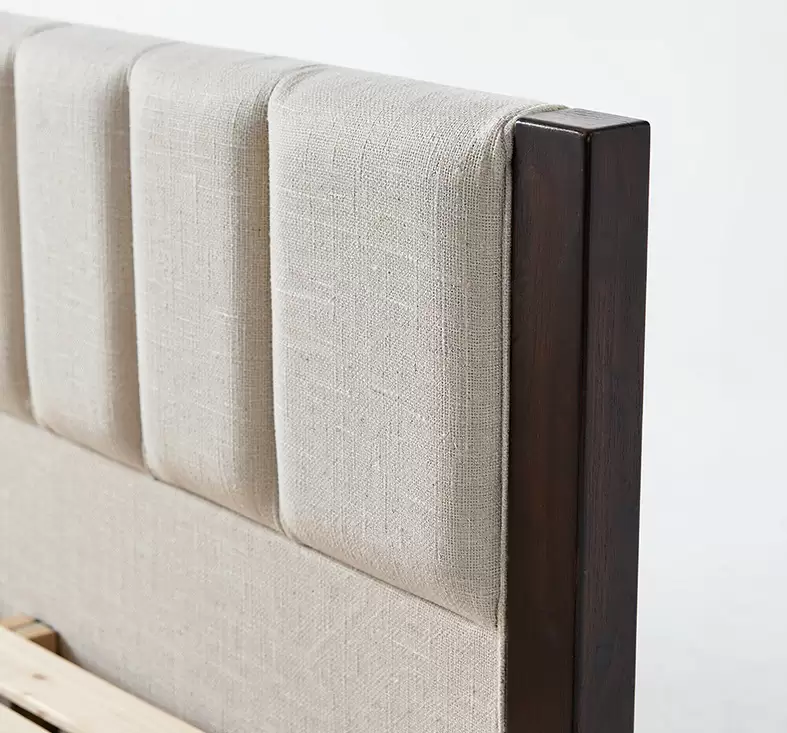 HM-LB-2603 beige linen upholstered bed with turned solid wood posts in a bright bedroom